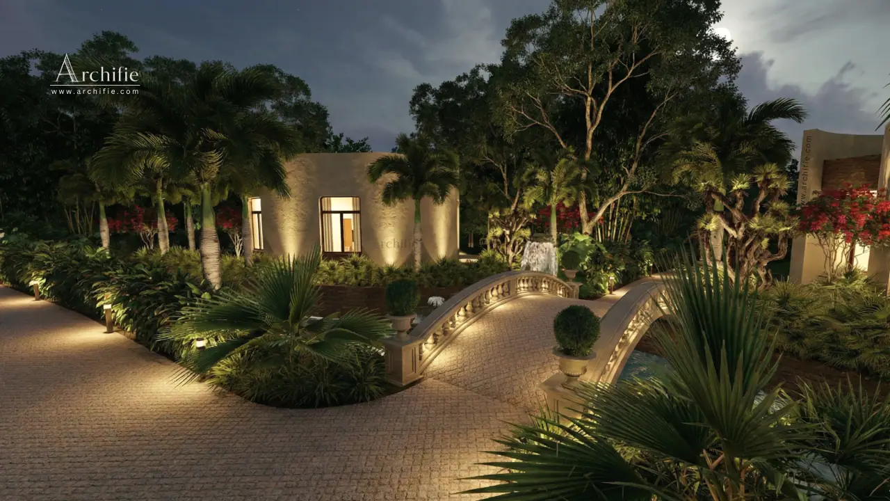 The illuminated stone bridgeway arching over water