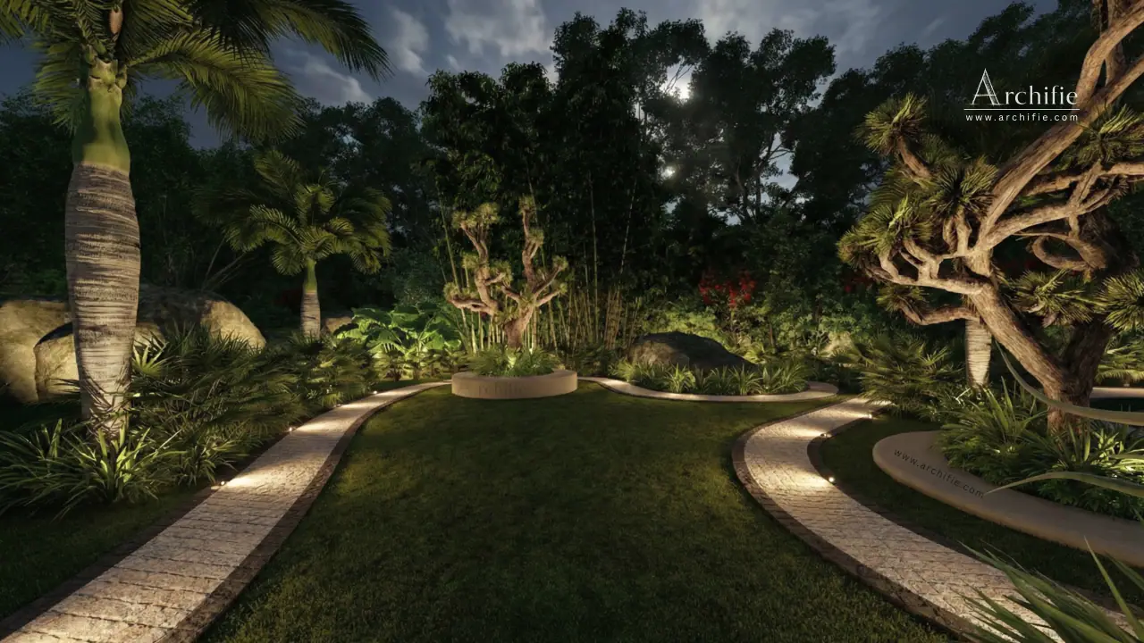 Two lamplit stone paths curving around a moonlit lawn to a sculpted tree